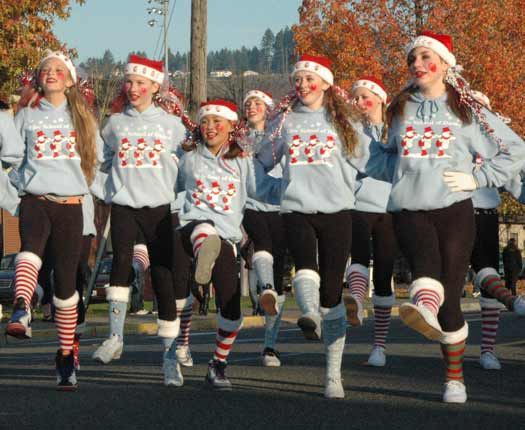 Members of the Elite School of Dance in Sumner kick their way down Main Street during the 2011 Santa Parade Dec. 3.