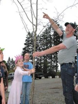 Birthday girl celebrates Earth Day with a tree planting party