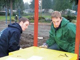 Volunteers gather for playground toys