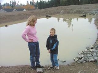 An unfenced pond raises mother's ire