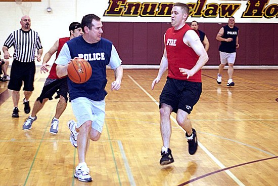 Greg Goral dribbles down the court in the 2010 Boots and Badges game.