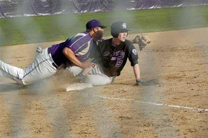 Brad Falk makes the play at third for the Spartans.