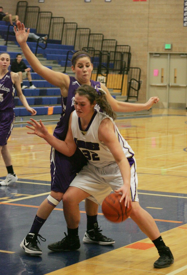 Jamie Lange drives to the hoop against North Kitsap Thursday in the West Central District playoffs. Sumner won 45-35.