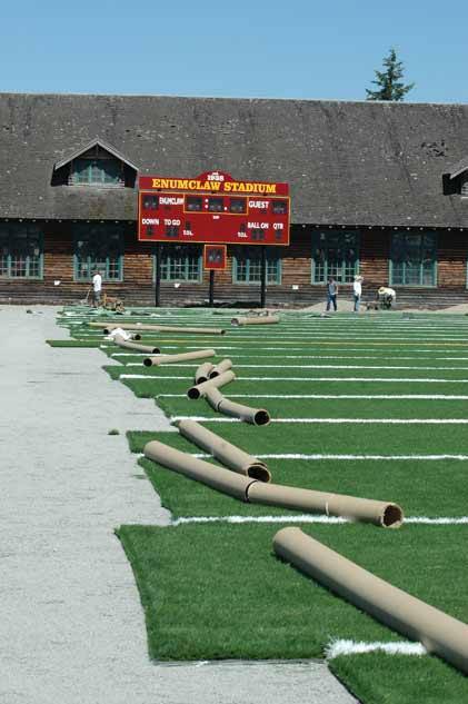 Crews continue work on installing the turf at Enumclaw's Pete's Pool stadium.