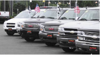 Vehicles fill local dealerships as people participate in the Cash For Clunkers program.