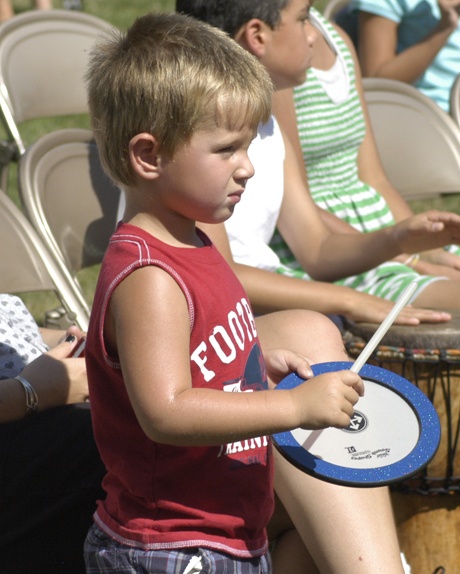 More than 200 children and some parents pounded on drums of all shapes and sizes