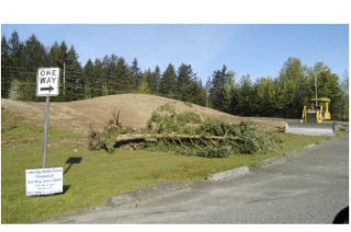 A bulldozer began work on a nearby hill at Lakeridge Middle School on Myers Road last week. The project includes replacing the current school to reduce overcrowding. The existing gymnasiums will be remodeled and incorporated into the new school which will be located behind the current facility. When the new school