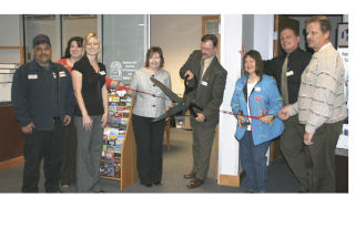 The Bonney Lake Chamber of Commerce sponsored a grand opening and ribbon cutting ceremomy April 16 at its new office in the Harborstone Credit Union Building. Celebrating the ribbon cutting were