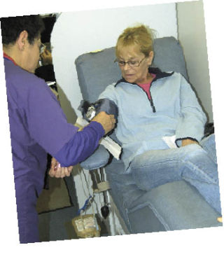 Cindy Hill of Bonney Lake gives blood during the Bonney Lake Senior Center Blood Drive April 2. According to Community Relations Specialist Rita Wells of Cascade Regional Blood Services