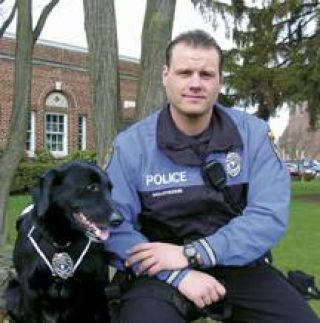 Shadow and handler Daron Wolschleger are now on duty