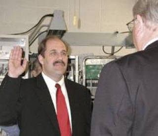 Second-generation postmaster Tim Stipek was sworn in on Friday.