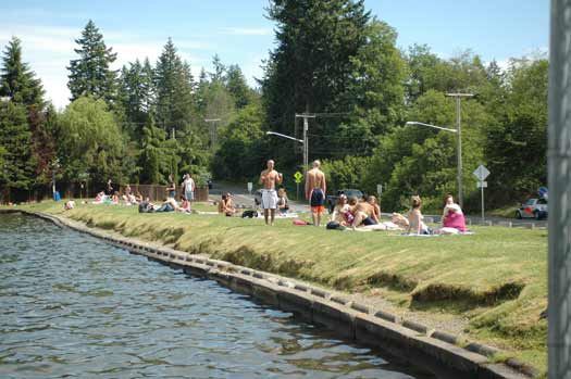 Sunbathers lay out on Dike 13 during a sunny day last year.