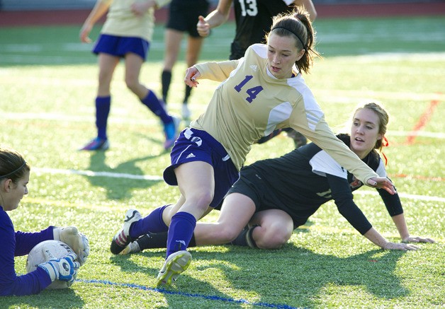 Brenna Allsop takes a slide in an unsuccessful goal attempt on the Wildcats.