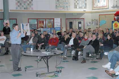 Harry Gibbons of Tetra Tech explains the Eurasian milfoil eradication plan to Lake Tapps residents at a meeting March 31 at North Tapps Middle School.