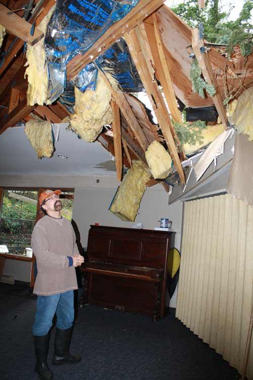 Pastor Kim Laterell surveys the damage at Creator Lutheran Church.