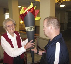 The Olympic 'torch' is passed at the Franklin House assisted living facility's games.