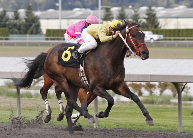 Polish Dollar and jockey Isaias Enriquez draw clear in the $18