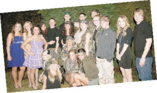 Friends from White River High’s junior class gather for photos Saturday before attending the school’s tolo dance.