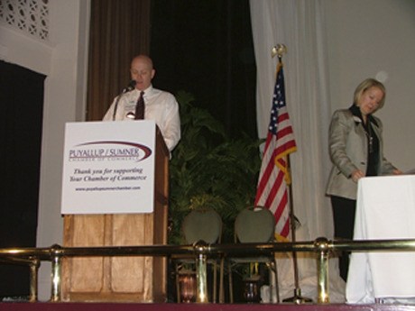 Outgoing Puyallup/Sumner Chamber of Commerce President Phil DeLong speaks as the chamber's executive director