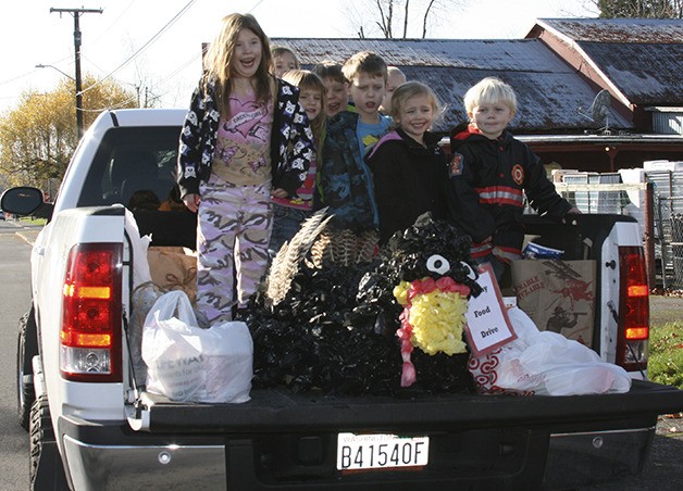 Youngsters from Cabin Kids Preschool showed their seasonal spirit by hauling a truck load of donations to the food bank.