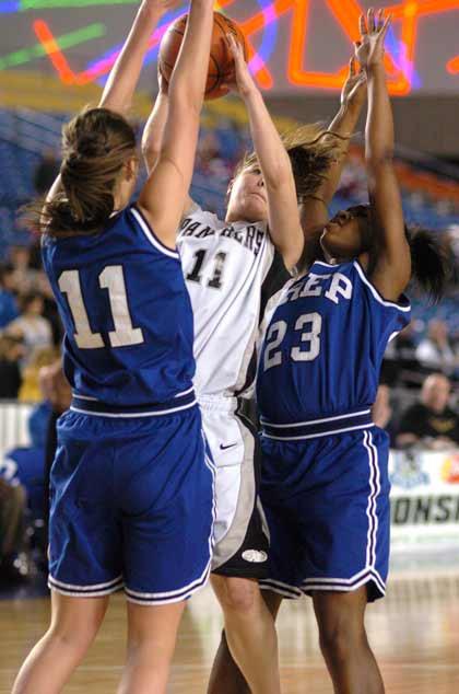 Bonney Lake's Rochelle Murray squeezes between Seattle Prep defenders at the state tournament.