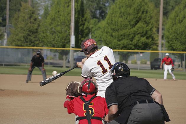 White River's Cole Johnson connects in the first game of the subdistrict tournament at Russell Road in Kent May 1. White River won 4-1.