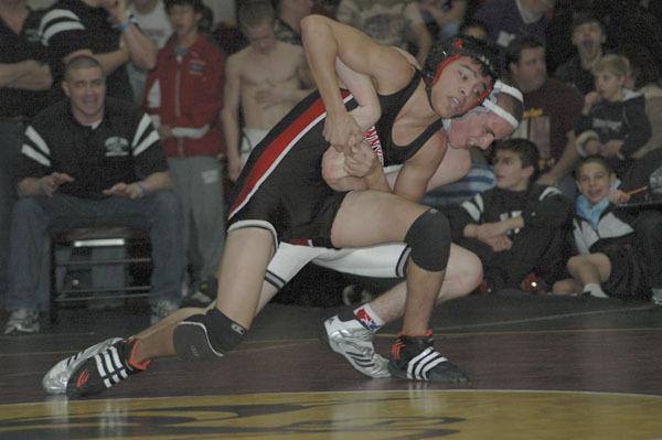 Bonney Lake High School Panther Andrew Cunningham takes down Nathan Gonzalez of Sunnyside during Saturday's final round for the 119-pound weight category.