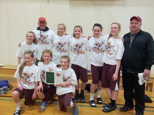 The Enumclaw Hornet sixth-grade girls basketball team includes: in front