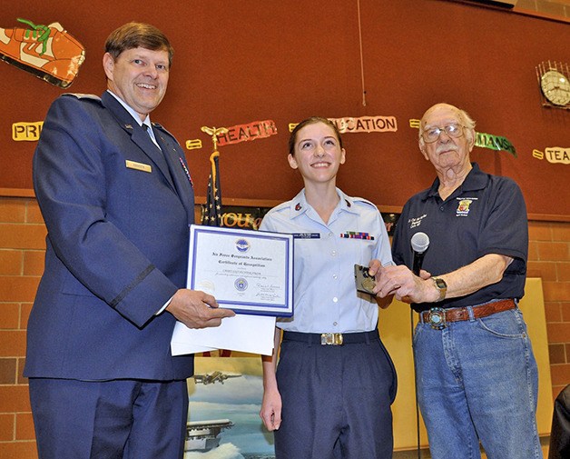 Enumclaw’s Hunter Storm receives the Air Force Association Award. Making the presentation were Lt. Col. Paul Hansen