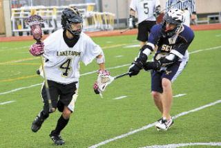 Bonney Lake’s Kegan Stanko moves the ball down the field offensively for the Titans.