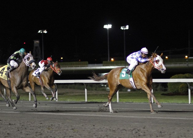 Stephanie Plum and jockey Leonel Camacho-Flores (No. 5) pull away for a 1-½-length victory Friday in the feature race for fillies and mares. April 19