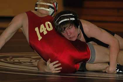 SHS's Tyler Hidalgo and EHS's Kyle Young went to the wire during action Jan. 27.