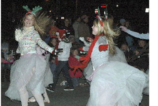 The Plateau Ballet Repertory Theatre gave Enumclaw Chamber of Commerce Christmas parade patrons along Cole Street a peek at “The Nutcracker Ballet” Saturday night. The Enumclaw-based ballet company will  perform the Christmas classic at 2:30 and 7:30 p.m. Saturday and Sunday at the Enumclaw High School auditorium. Tickets are $12 for adults and students. Children 12 years old and younger are $10. Senior citizens 65 years old and older pay $8. For information