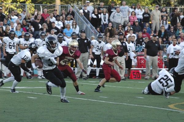 Robert Combs runs the ball