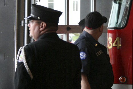 Fire station Honor Guard take a final look at Buckley Fire Department's Volunteer Station 1.