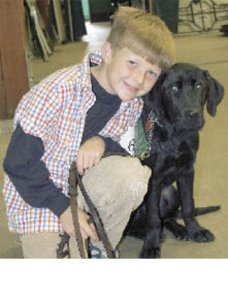 Volunteers like Austin Schuver and guide dog candidates like McKinley spend months together.