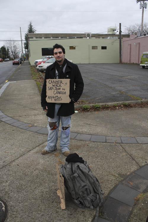 Cory McManus solicits donations on the corner of Cole Street and Stevenson Avenue. The 20-year-old San Jose native