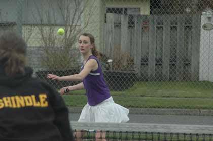 Sumner's Jasmine Babcock sends a volley back across the net in doubles action with White River Thursday.