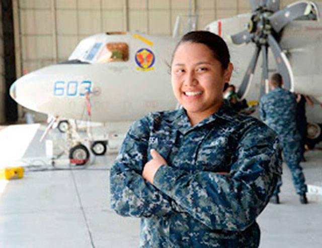 Former Enumclaw resident Coretti Fea flies the navy’s Hawkeye carrier-based aircraft to keep watch over water. Contributed photo.