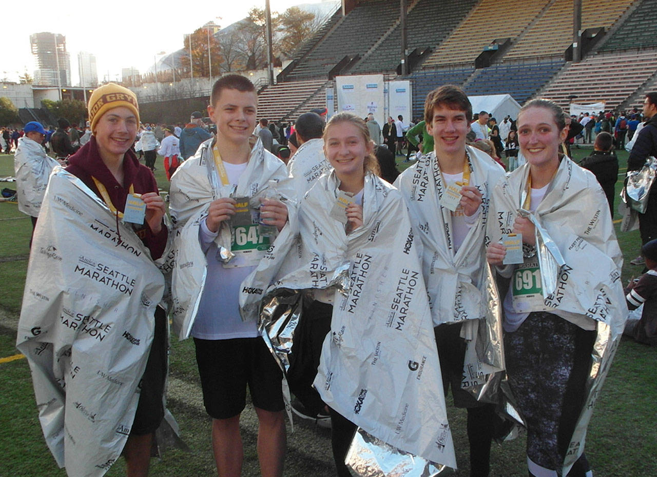 White River runners Joel Slominski, Ronnie Riggs, Hannah and Grant Swettenam and Claire Lowe competed Nov. 26 in the Seattle Half-Marathon. Photo by Mark Slominski