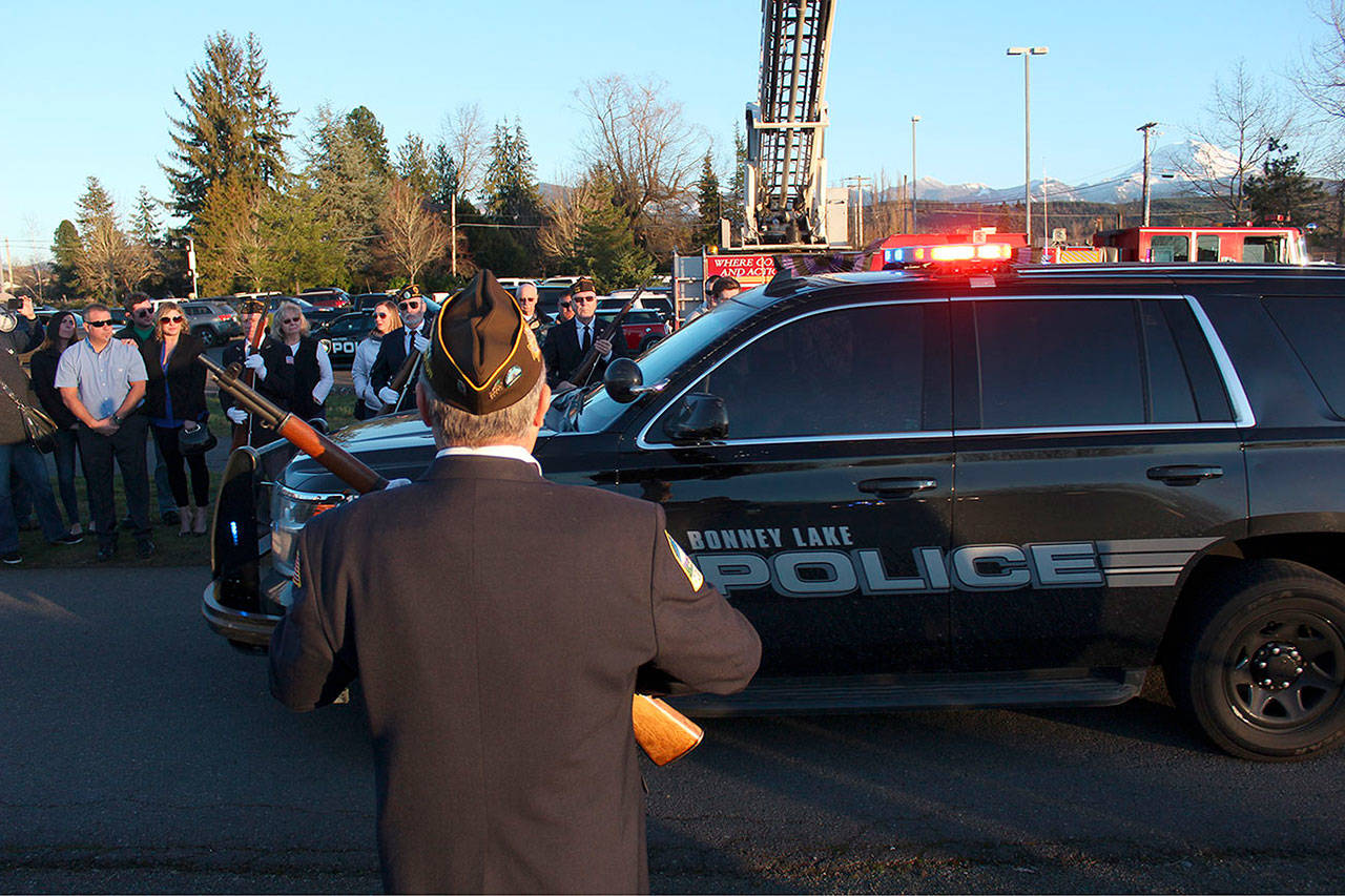 Family, friends, vets, and first responders lined the Weeks’ Funeral Home driveway to give honors to James Larson and Zach Roundtree as they passed in a police procession. Photo by Ray Still