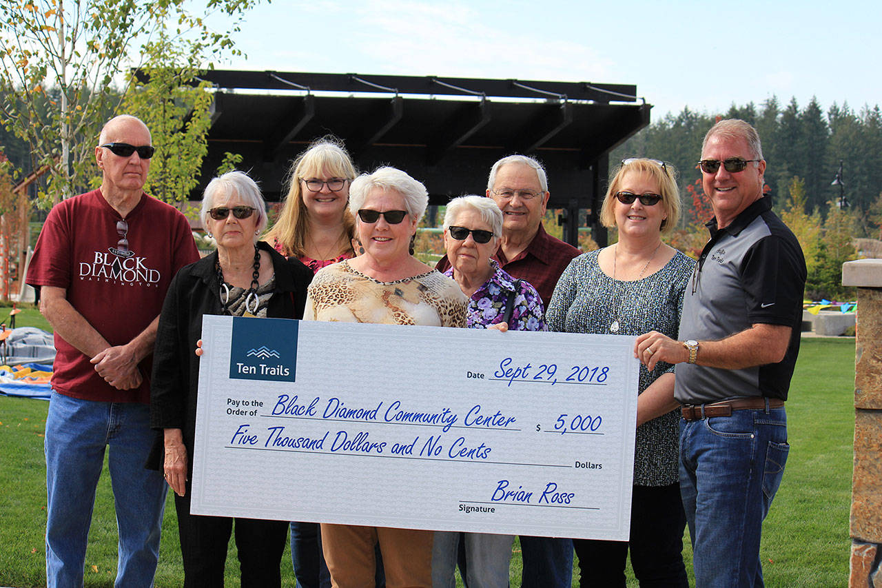 The Black Diamond Community Center was one of three Black Diamond organizations to receive donations from Oakpointe, the developer of the Ten Trails neighborhood in the city. Pictured are members of the Black Diamond Community Center Board, BDCC Executive Director Cheryl Hanson, center, and Oakpointe CEO Brian Ross, far right. Photo courtesy of Ten Trails.