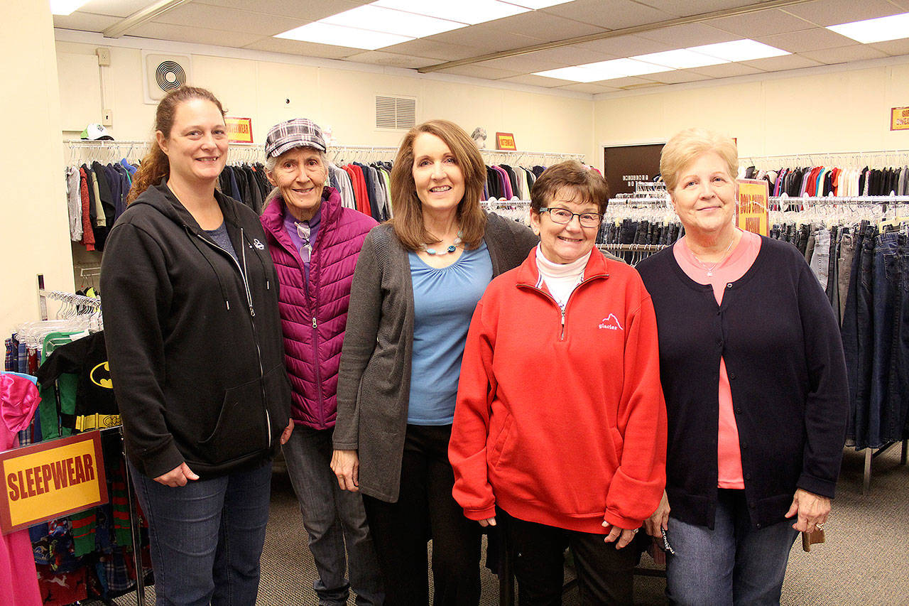 Roughly 10 volunteers are devoted to the Donald Loomis Memorial Clothing Bank, including (from left to right) Jolene John, Julia Wentz, Sheila Smith, LuAnn Hedges, and Nancy Loomis. The clothing bank is supported by the White River School District, the Buckley Kiwanis Club, the patrons of Elk Head Brewery, and other individual donors. Photo by Ray Miller-Still