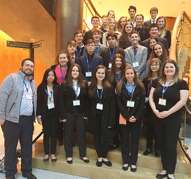 Pictured is the Bonney Lake High DECA team that attended the recent state conference. In front (left) is business teacher Joshua Kern; at right is club adviser Felicia Kern. Submitted photo.