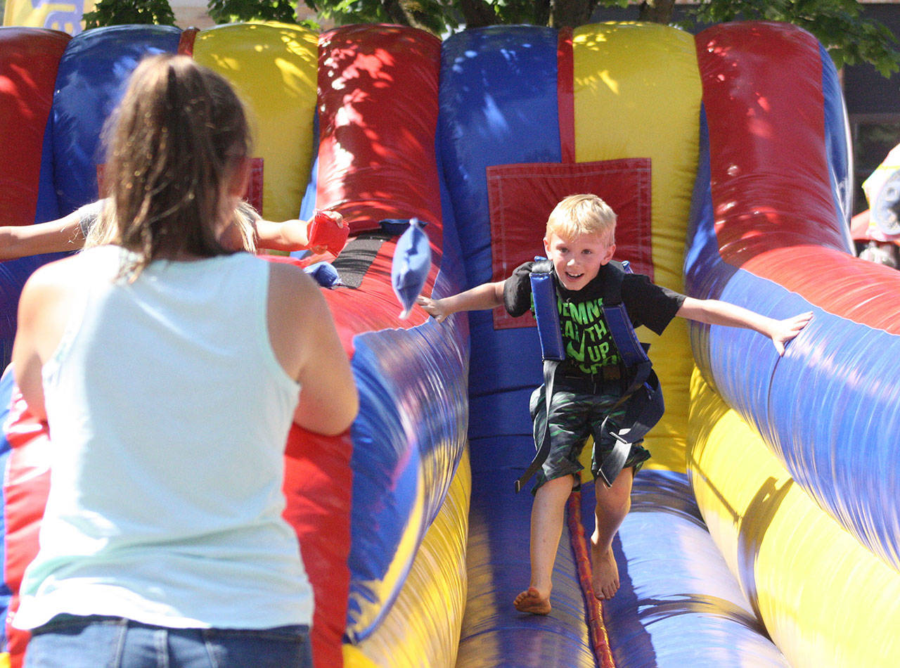 Both free and charged activities for kids and families will be available at this year’s street fair. File photo by Kevin Hanson