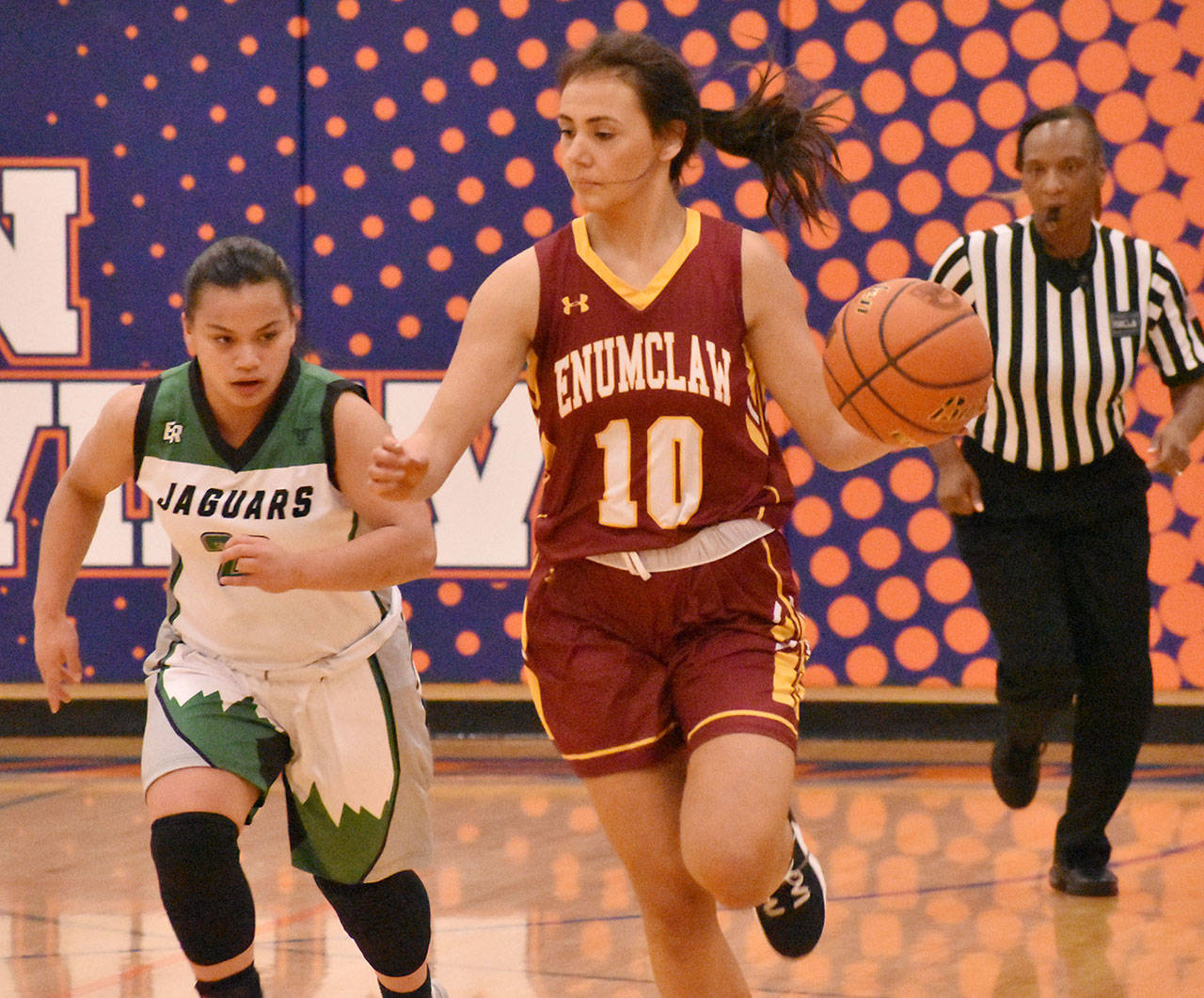 The Enumclaw High girls took to the road and defeated Emerald Ridge on Feb. 11. Pictures is Olivia Rodarte racing past a Jaguar defender. Photo by Kevin Hanson