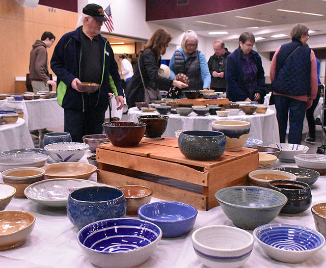 The annual Empty Bowls event was a success again this year, as the community came together to raise money in support of the less fortunate. It was an all-volunteer event to make pottery bowls, provide a simple meal, and host a Feb. 28 crowd at the Enumclaw High School commons. Proceeds from the fundraiser will go to Plateau Outreach Ministries, which provides food and other necessities to those in need. Photo by Kevin Hanson