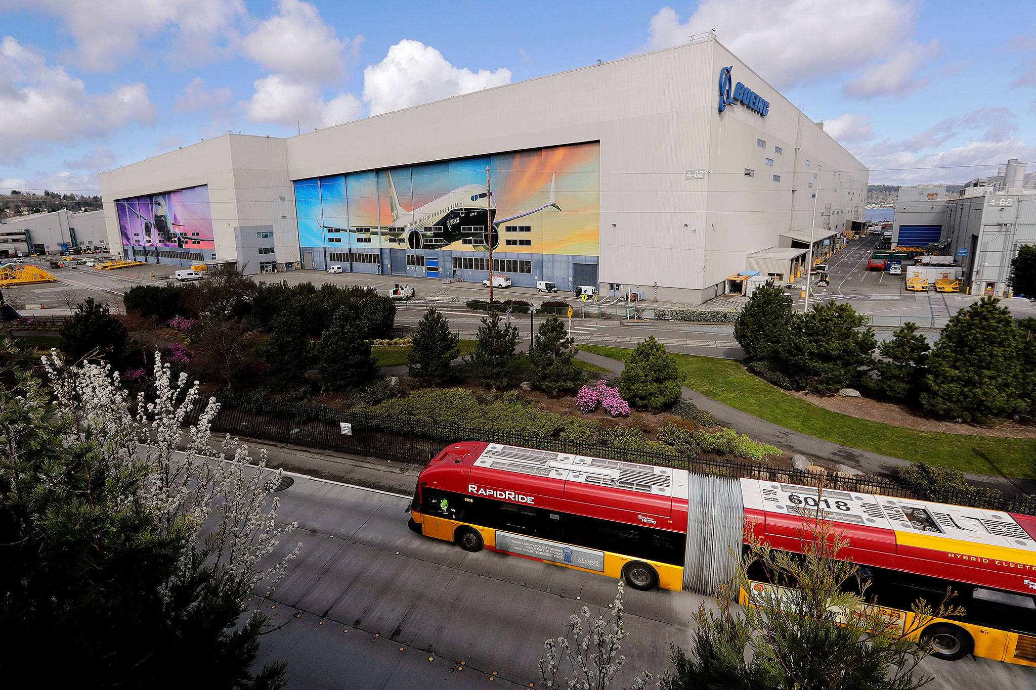 The Boeing airplane manufacturing plant in Everett, where murals of jets cover the massive doors, on Monday. (AP Photo/Elaine Thompson)