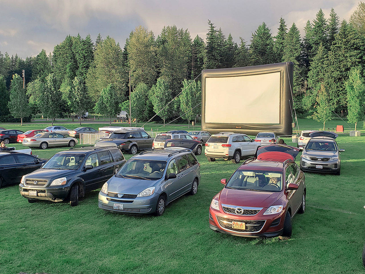 The Enumclaw Expo Center’s drive-in movies are shown on a 40-foot screen, with audio put through the radio. Photo by Ray Miller-Still