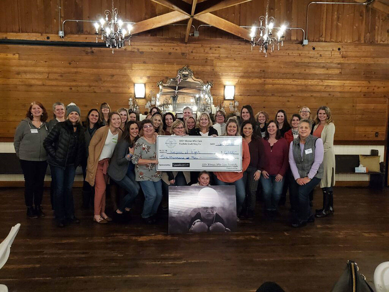 100+ Women Who Care donated $6,000 to the Covington-based Footprints of Fight organization, which offers free services and support like house cleaning, grocery and gas cards to Washington families affected by pediatric cancer. Photo courtesy 100+ Women Who Care